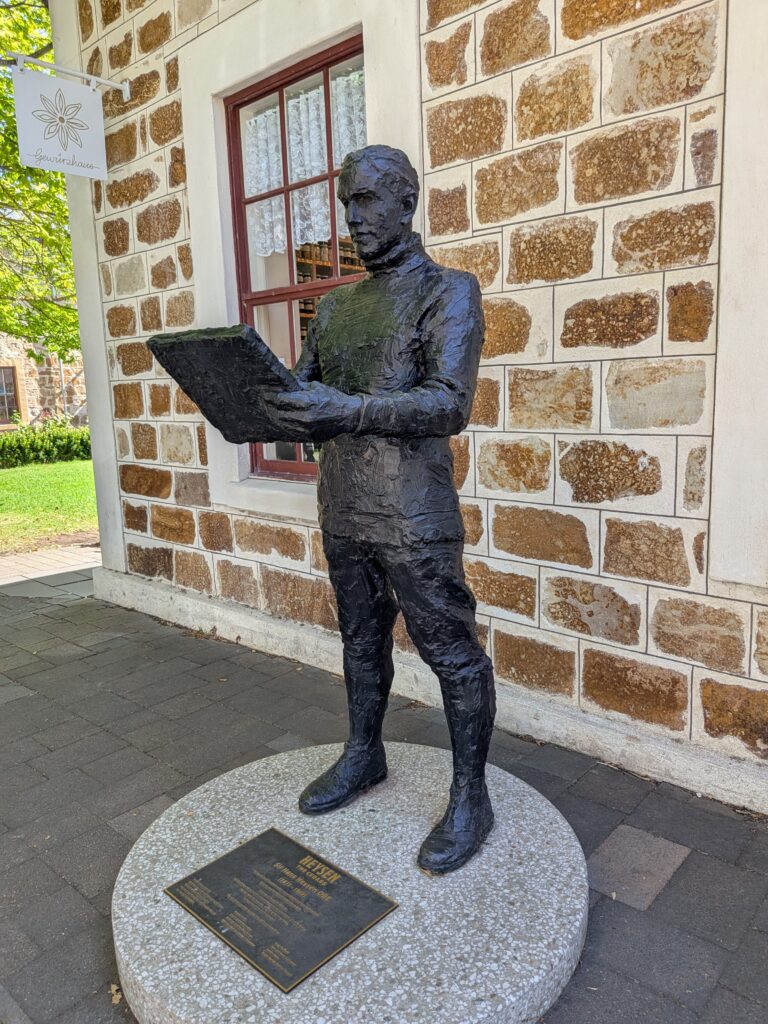 Statue of Sir Hans Heysen outside the old school house, now a herb & spice shop